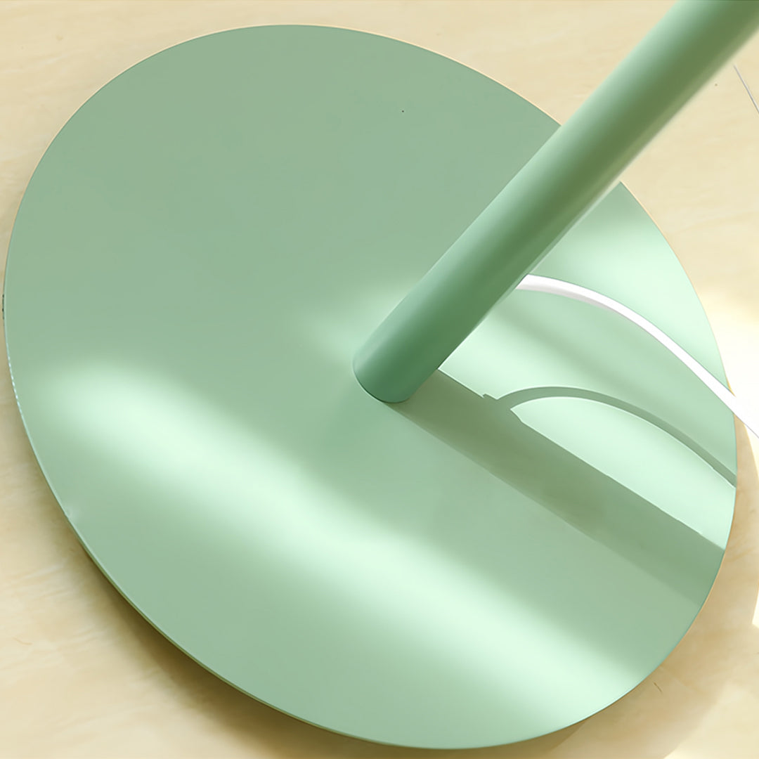 Designer colored floor lamp in mint green showing detailed base construction and premium materials