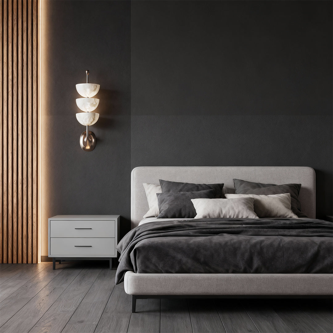Designer modern LED wall lights featuring glass shade chandelier influence creating warm glow in luxurious bedroom with wood slats.