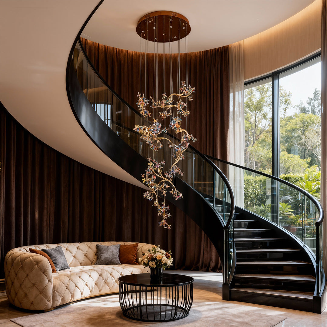 Designer modern staircase chandelier with glass shade chandelier aesthetic providing elegant illumination in warm-toned entry with sculptural stairs.