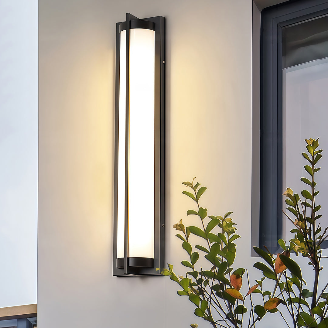 Designer outdoor wall sconces black featuring glass shade chandelier aesthetic creating warm ambient lighting on modern white exterior.