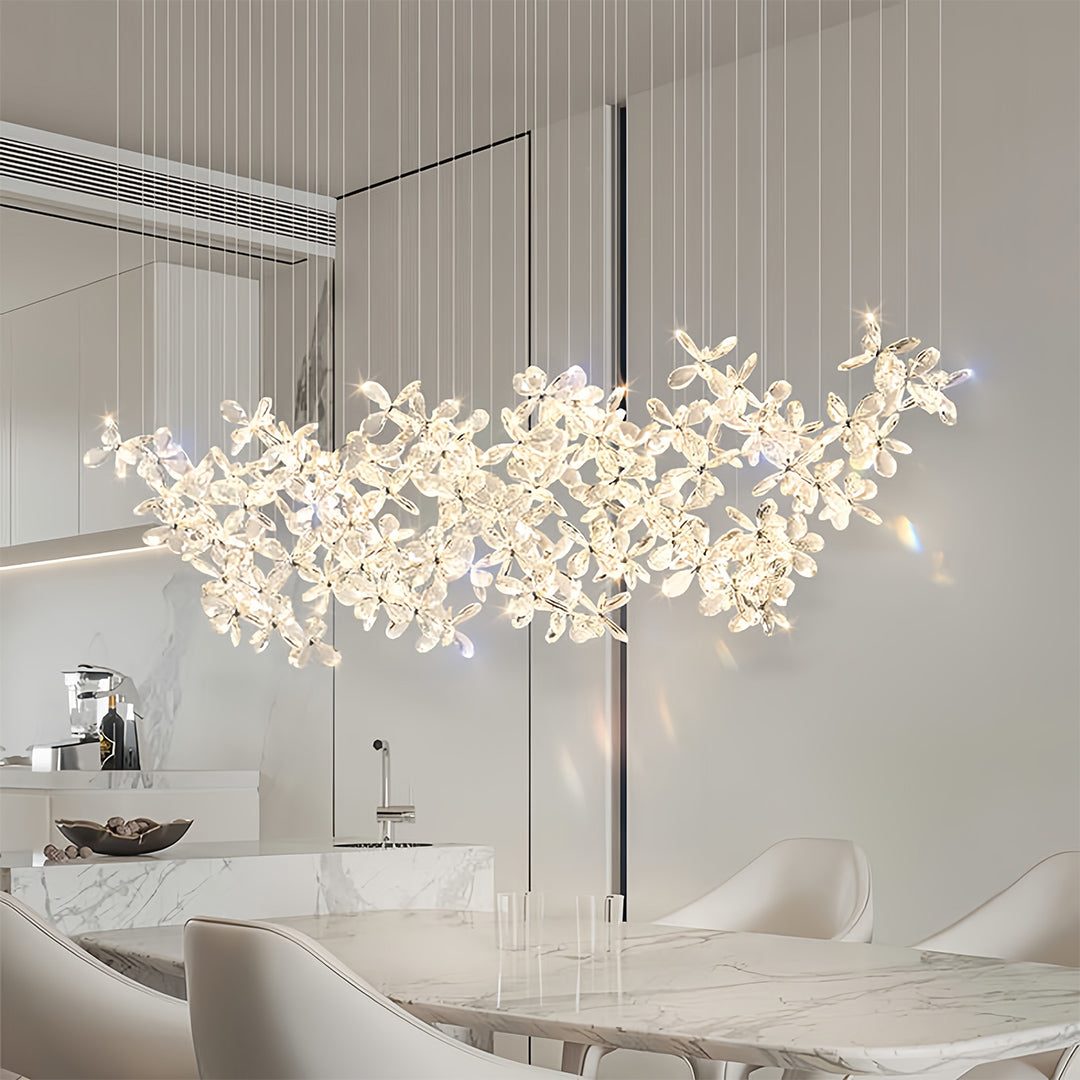 Designer rock crystal chandelier creating ambient illumination in modern bathroom with clean lines