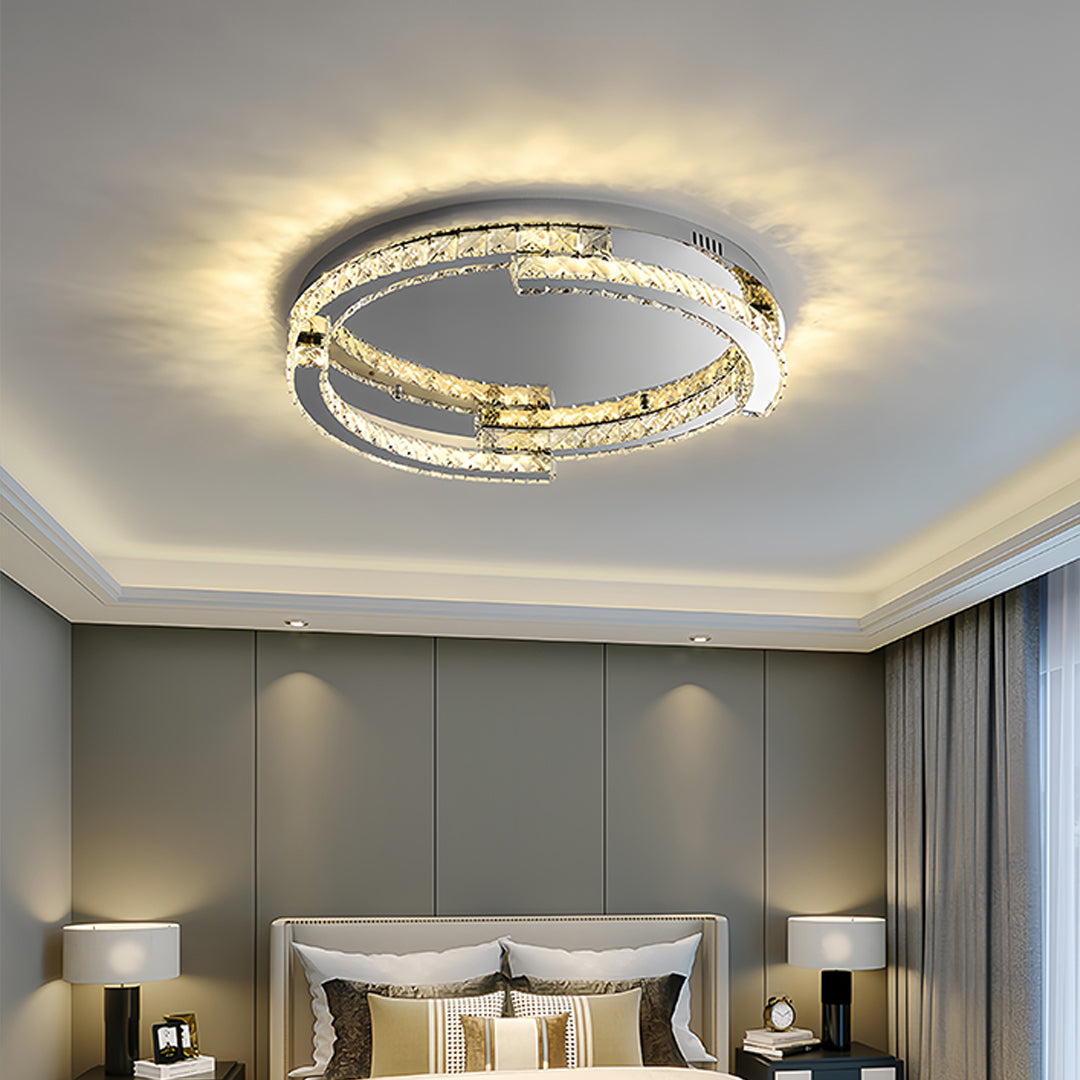 Designer silver flush mount ceiling light featured in luxury bedroom with neutral color scheme