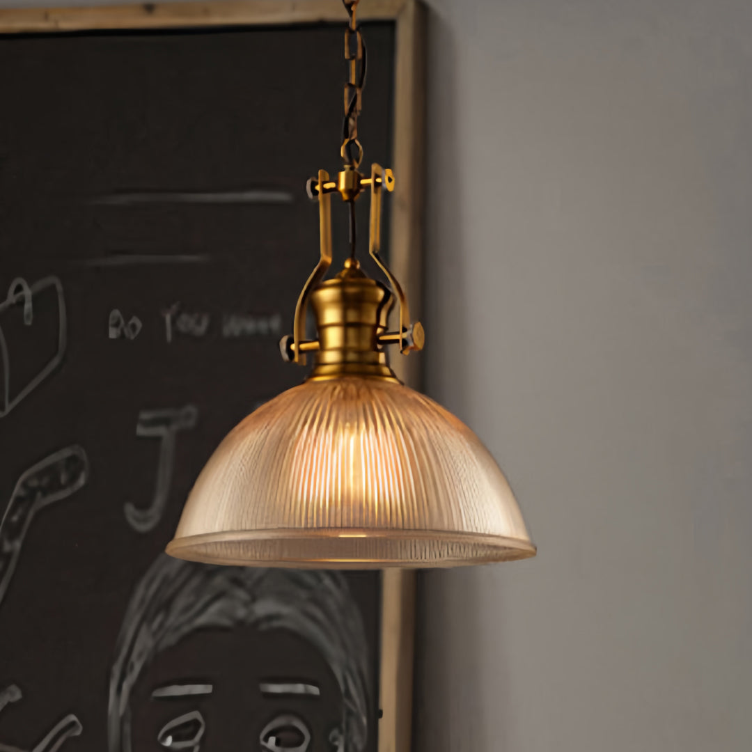 Designer textured glass pendant light with ribbed clear shade creating beautiful light patterns in modern interior