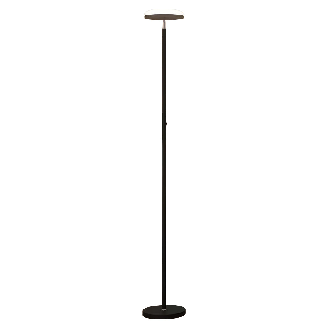Designer uplight floor lamp with white base creating elegant ambient lighting in contemporary interior space
