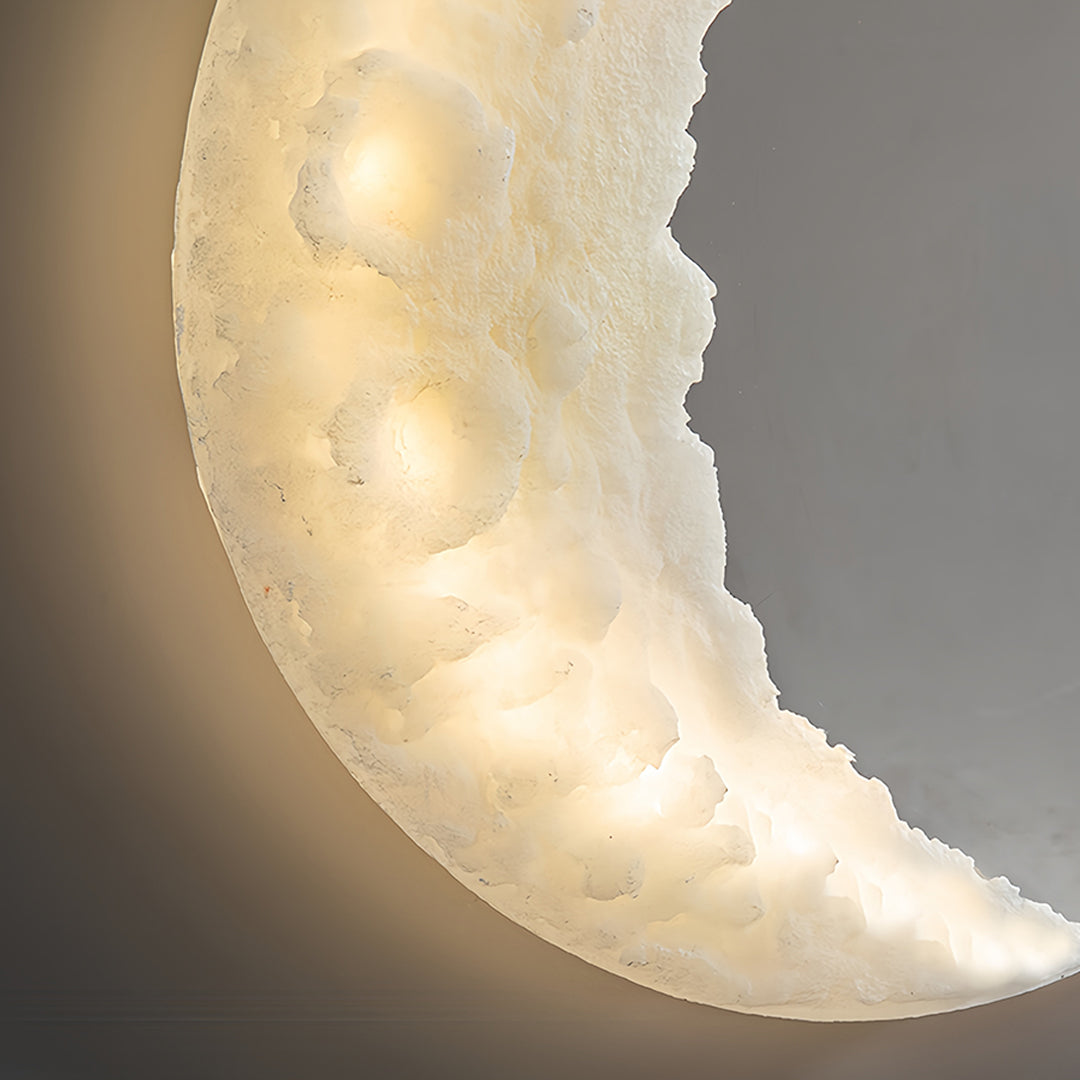 Designer wall light moon creating dramatic accent lighting in stylish interior setting