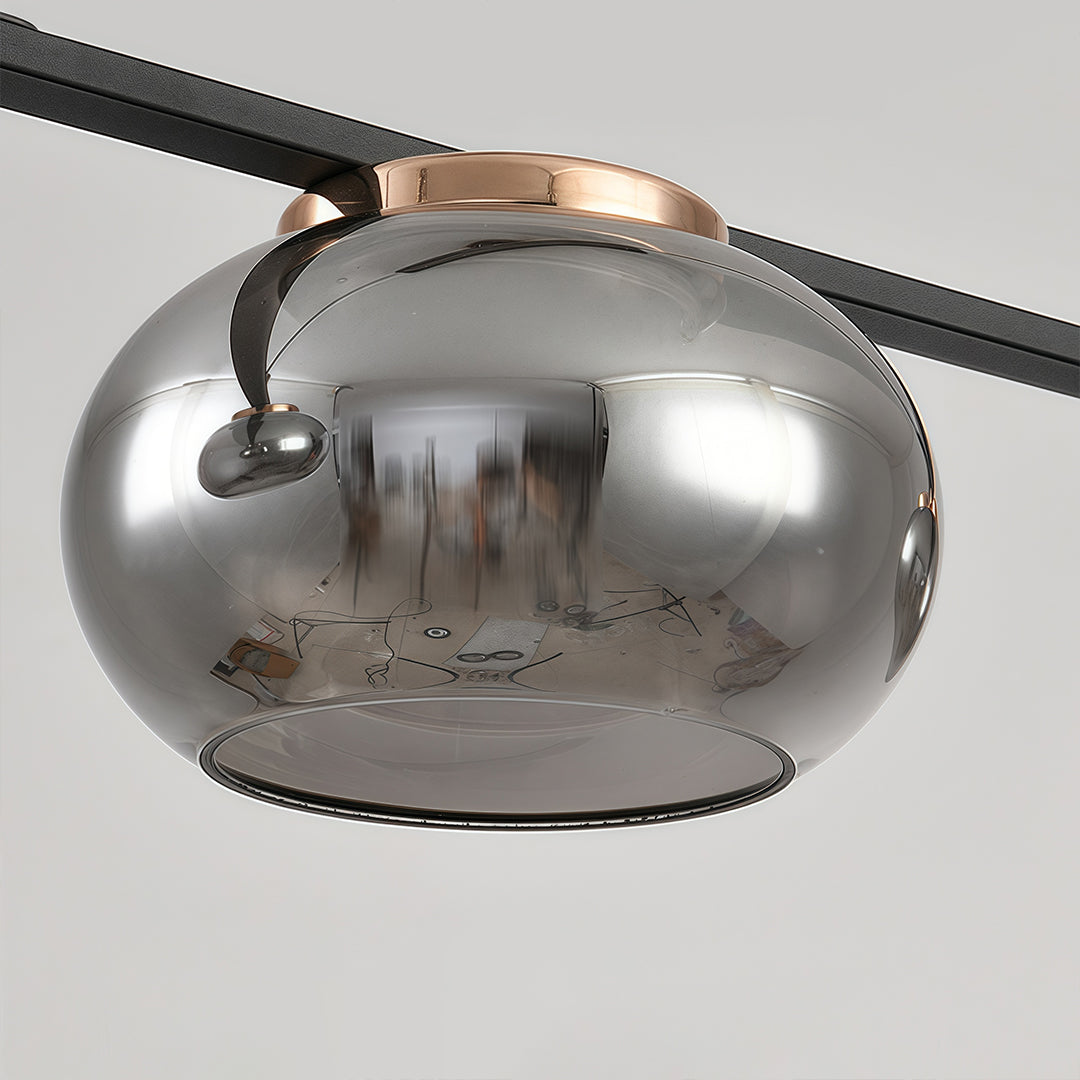 Detail view of gray glass pendant light with metallic chrome dome shade and reflective mirror finish.