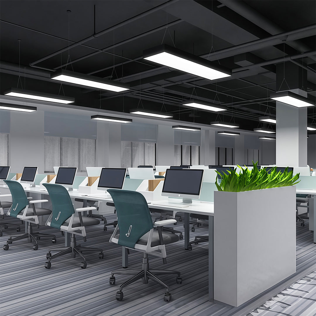 Detail view of the sleek lines and structure of a long rectangular chandelier, designed for modern commercial use.