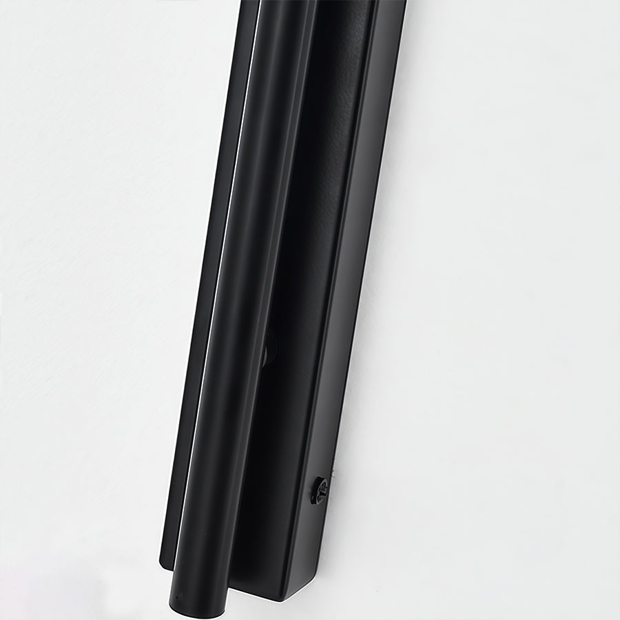 Detail view of wall arm light vertical black metal pole with ribbed texture and mounting hardware.