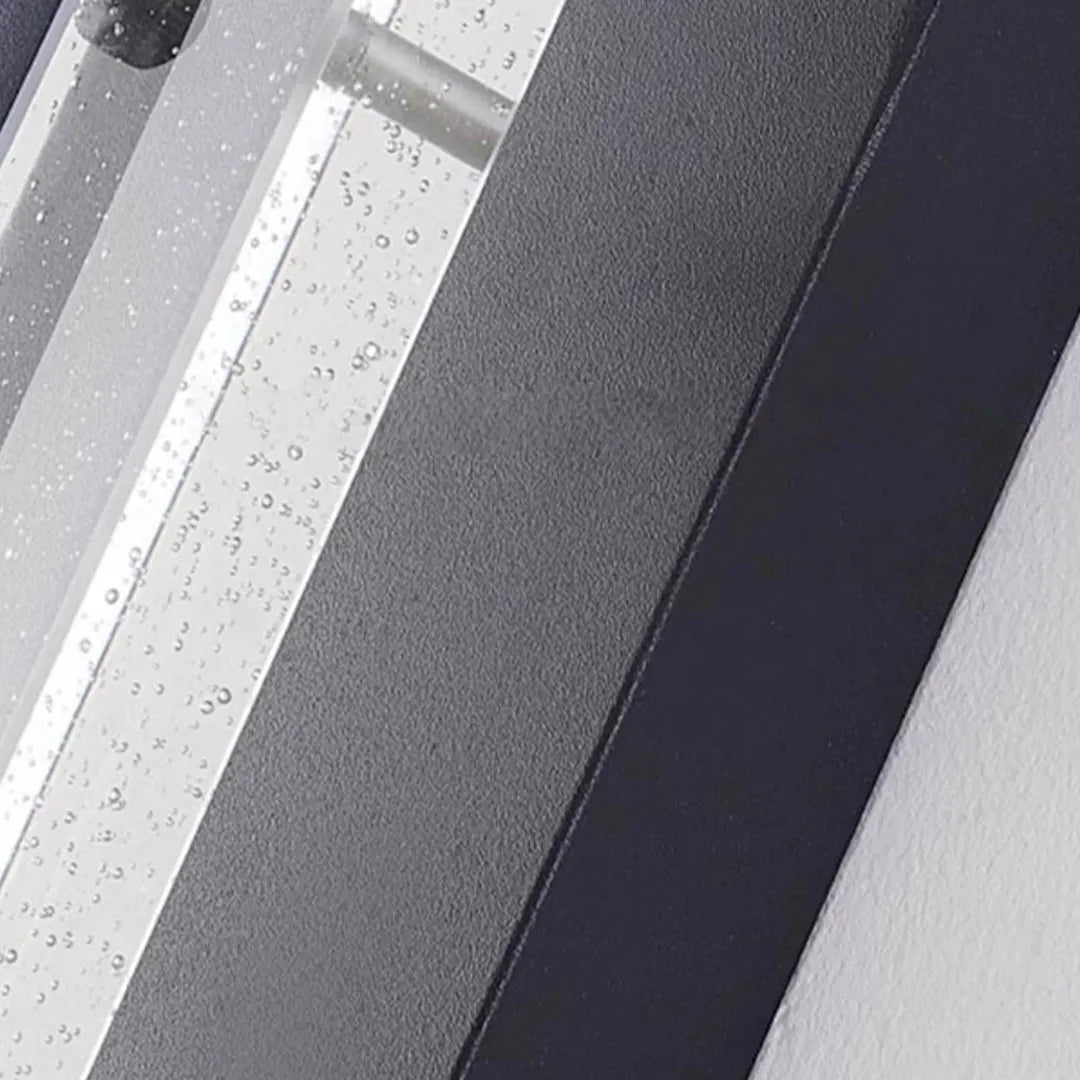 Wall mount outdoor lighting detail highlighting the durable black aluminum housing and diffuser.
