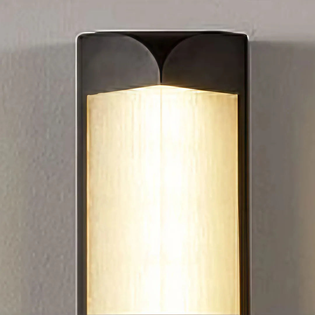 Wall sconce outdoor detail highlighting the frosted diffuser and durable aluminum frame.