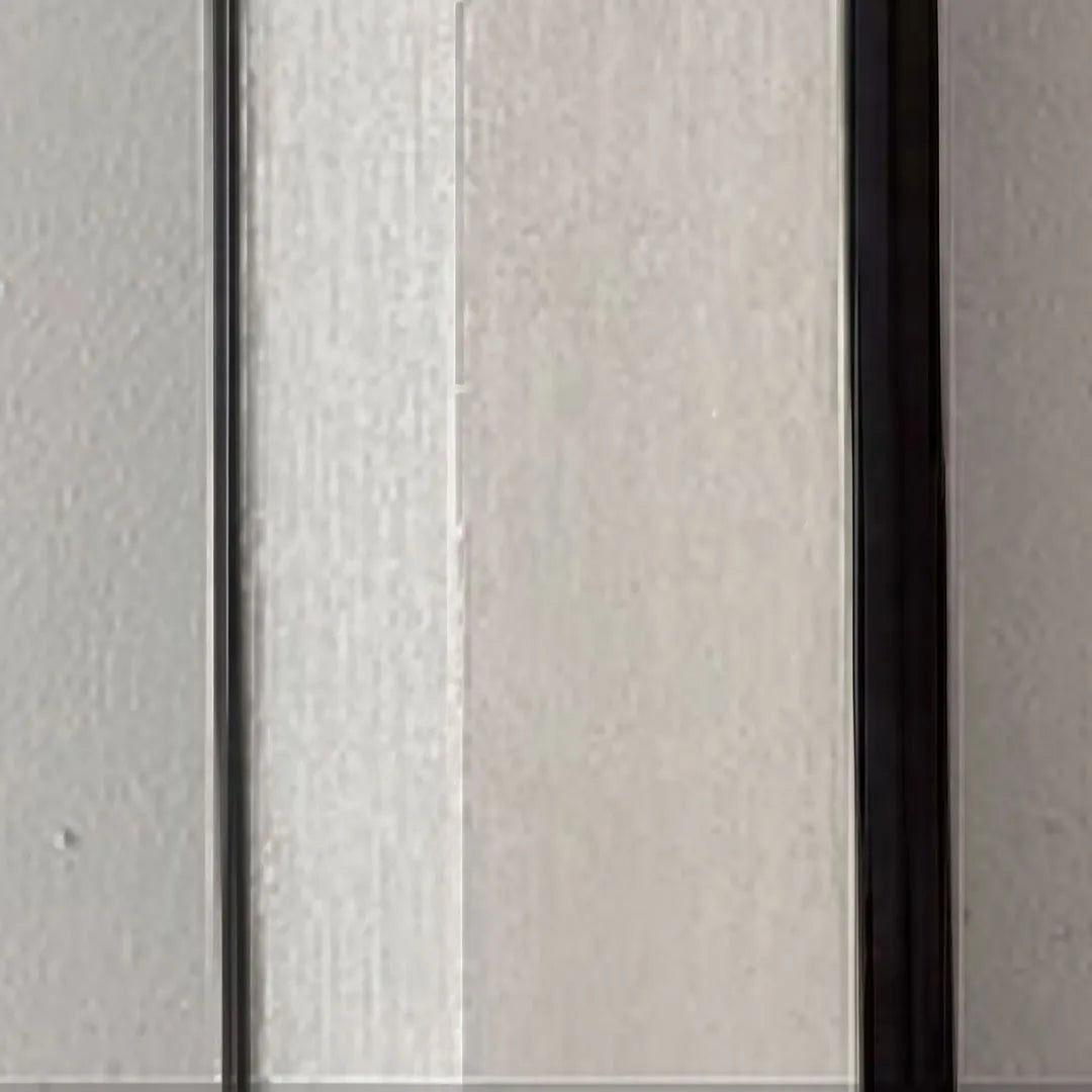 Wall sconce outdoor detail highlighting the frosted diffuser and durable aluminum frame.