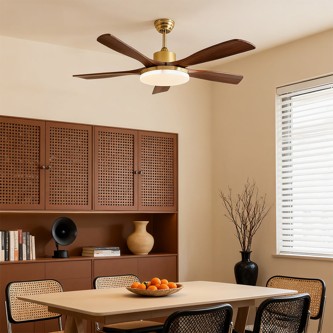 Detailed view of ceiling fan blades, showcasing the wooden texture and gold trim.