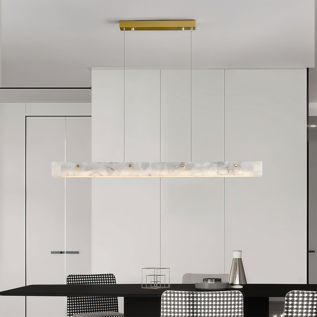 Detailed view of a copper metal pendant light, highlighting the gold accent and marble texture