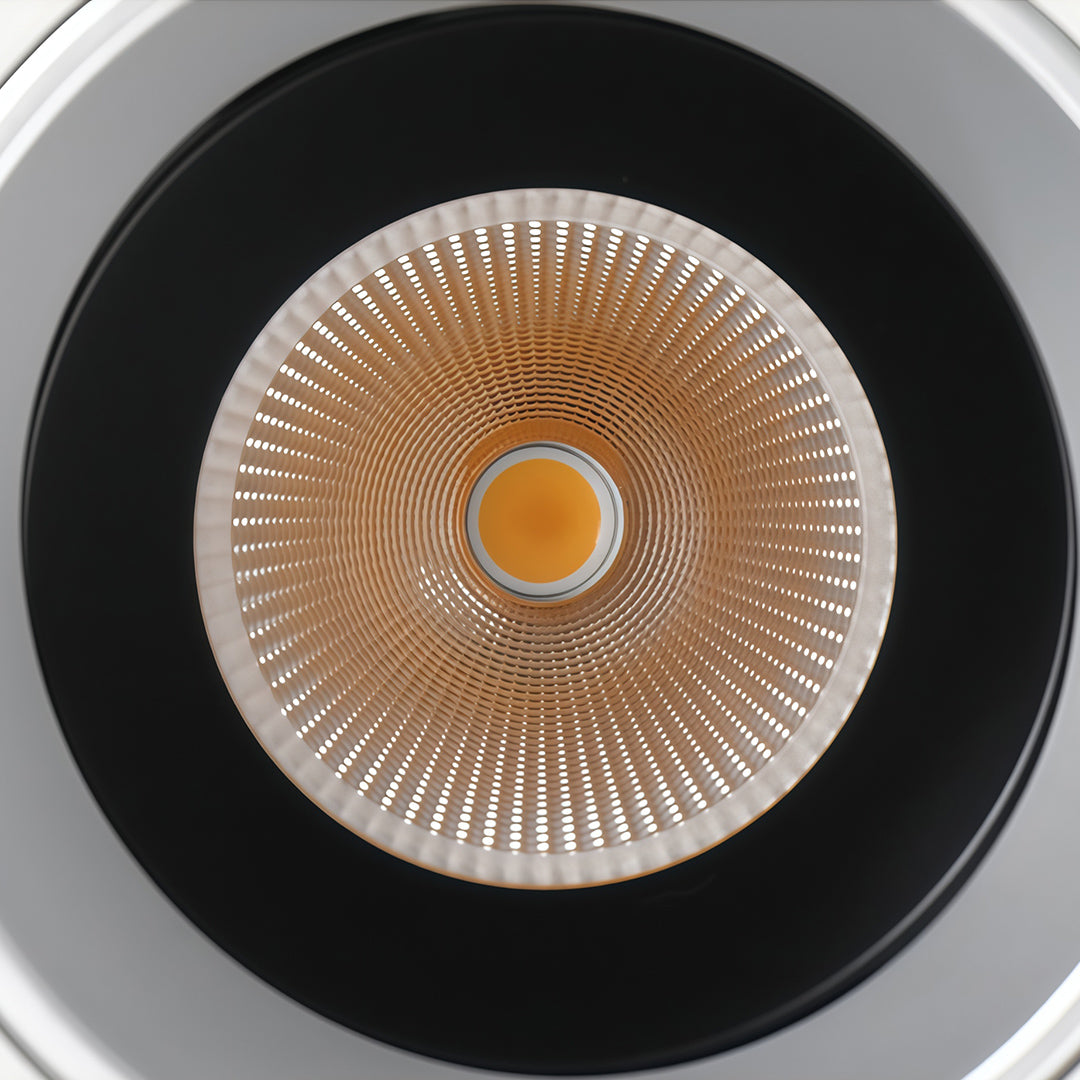 Detailed view of flush mount spotlights featuring glass shade chandelier design showing precision COB LED and reflector optics.
