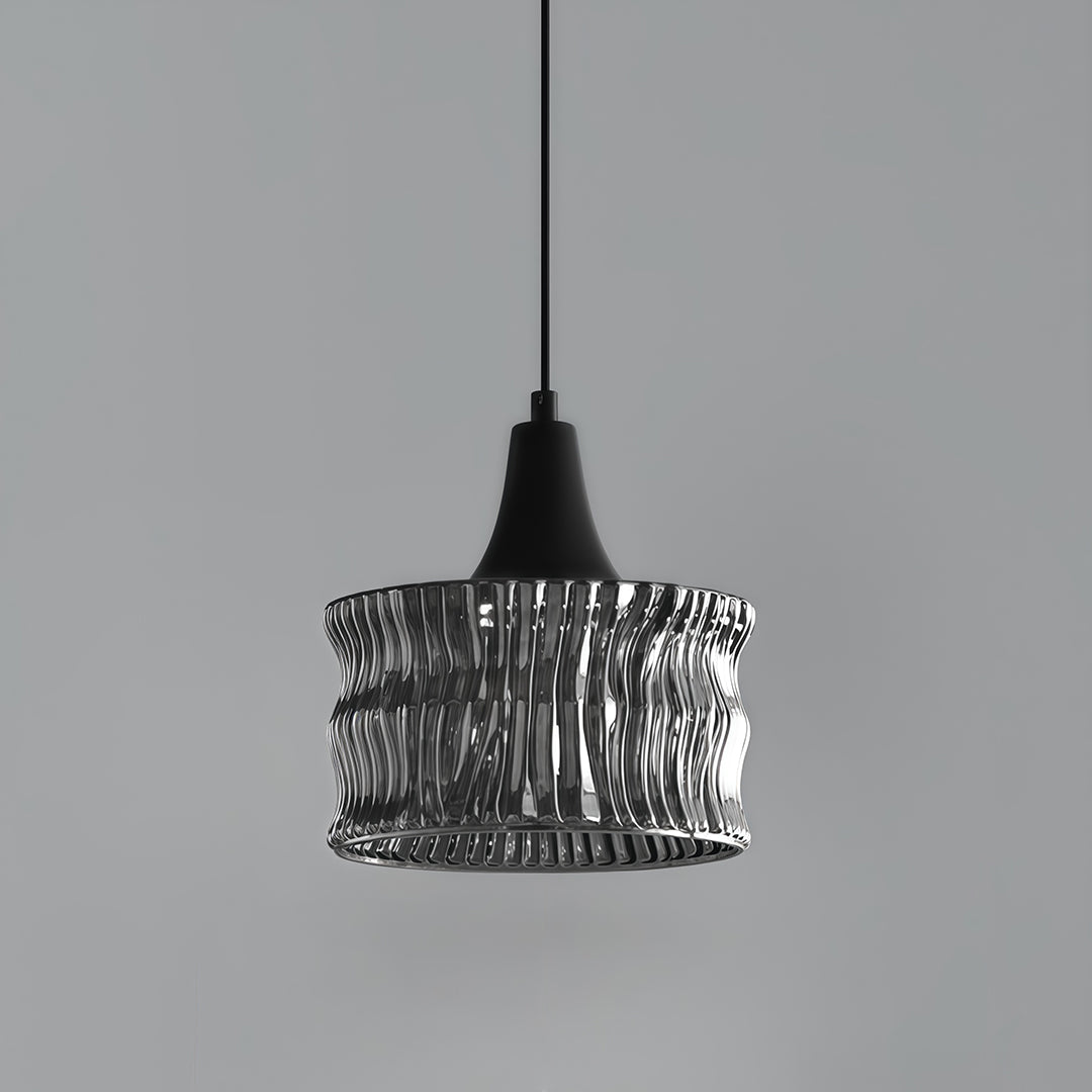 Detailed view of the bottom of a glass drum pendant light, showcasing the unique glass texture and light effect.