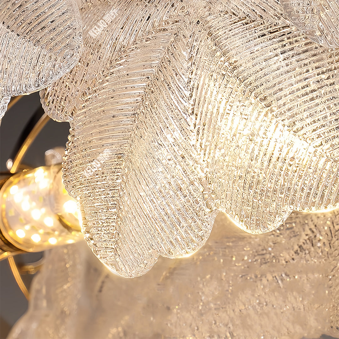Dramatic close-up view of glass garland chandelier lights showcasing intricate petal details and warm LED glow