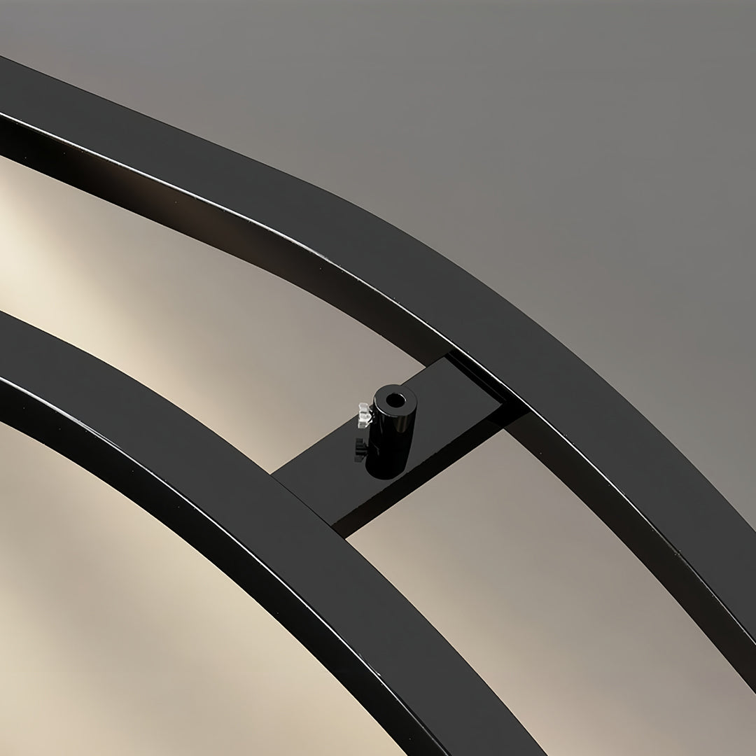 Detailed view of the black kitchen island pendant light structure, showing the mounting points and the seamless integration of the light element.