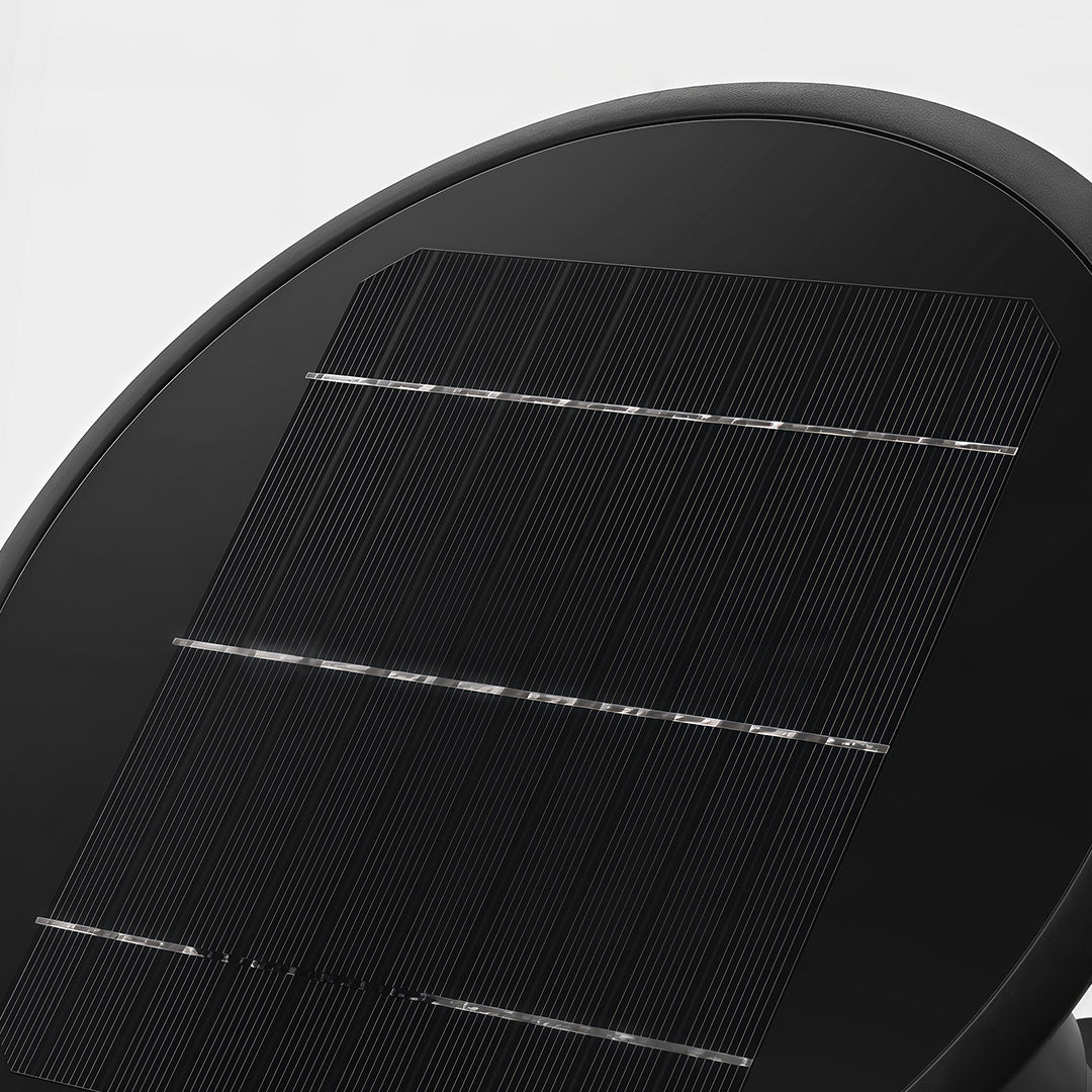 Detailed macro shot of the round solar panel on top of the fence post cap lights fixture.