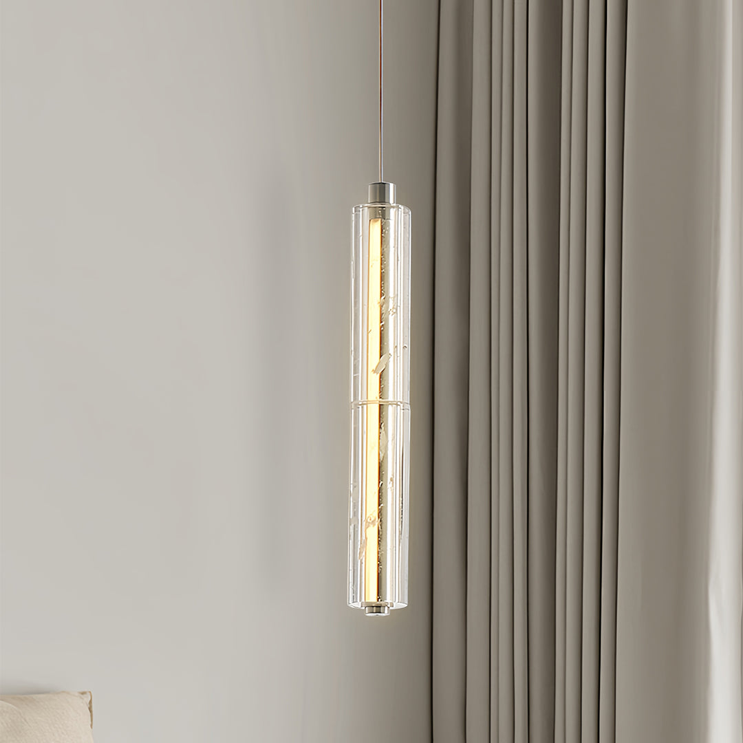Detailed view of a modern crystal pendant light highlighting the crystal texture and light diffusion.