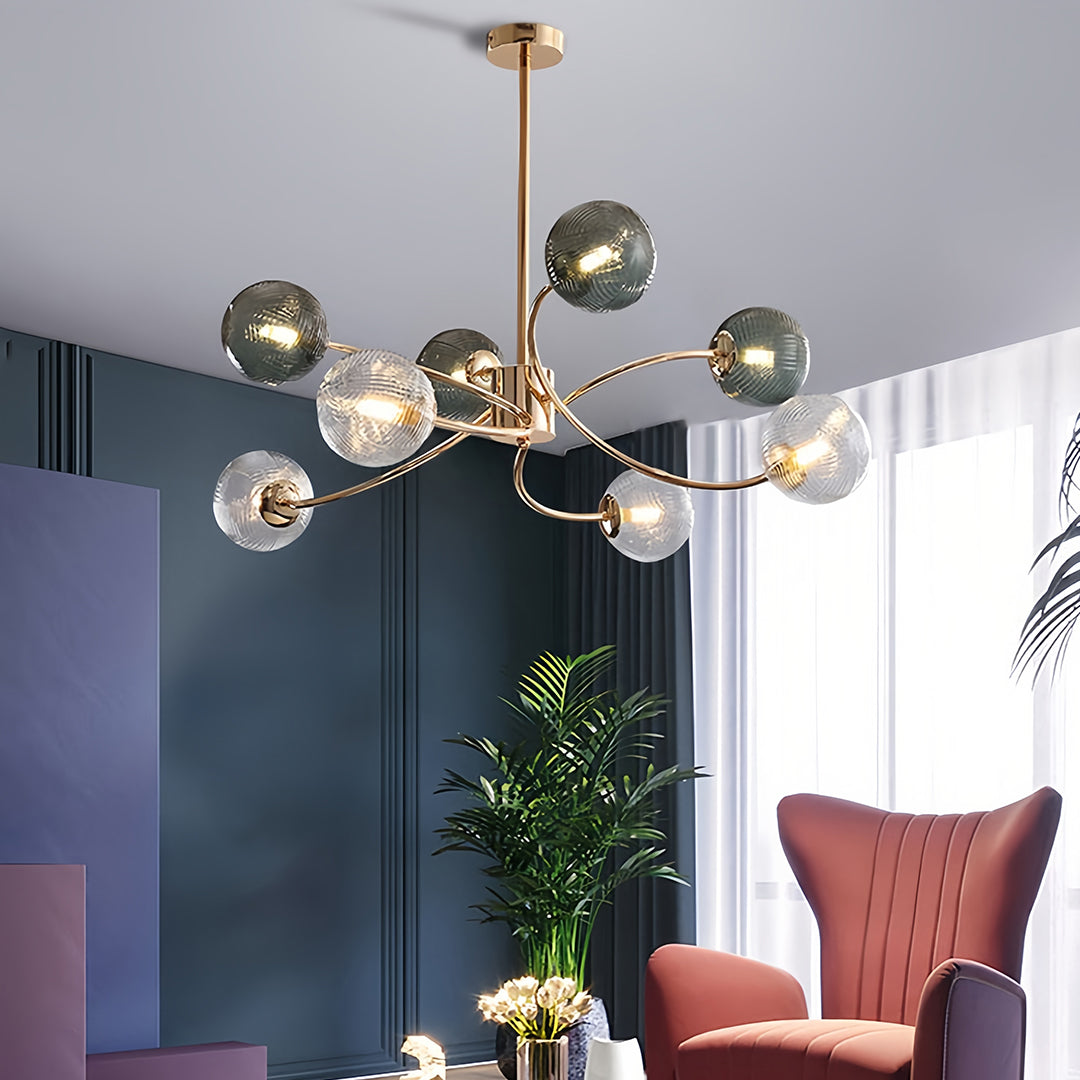 Detailed view of the multi-bulb clear glass flush mount ceiling light with ornate, curving arms and sparkling light effects.