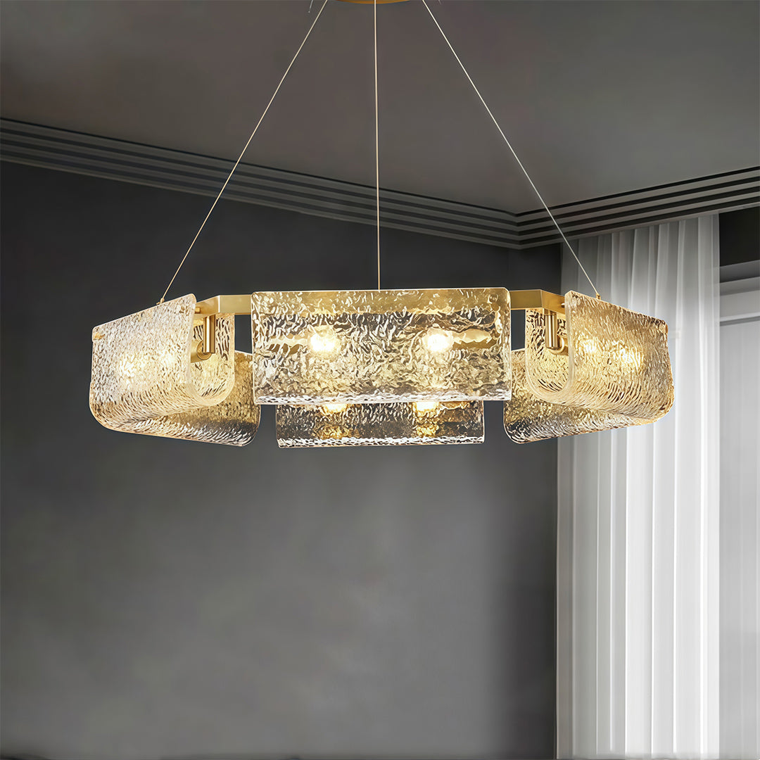 Detailed view of a rectangular glass chandelier, showcasing the intricate glass texture and gold accents.