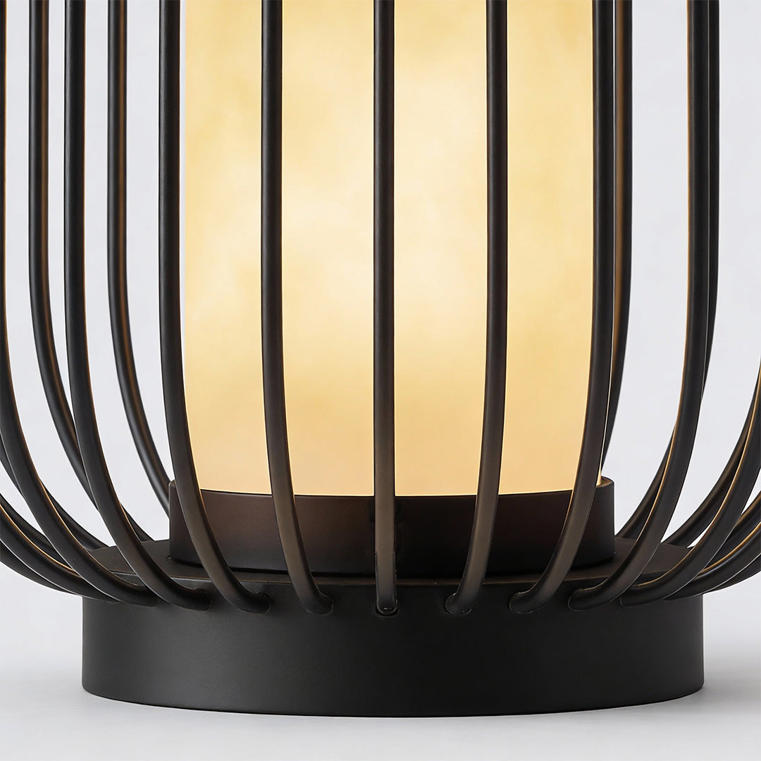 Lantern metal outdoor light with detailed slat pattern, highlighting warm light diffusion for stylish decor.