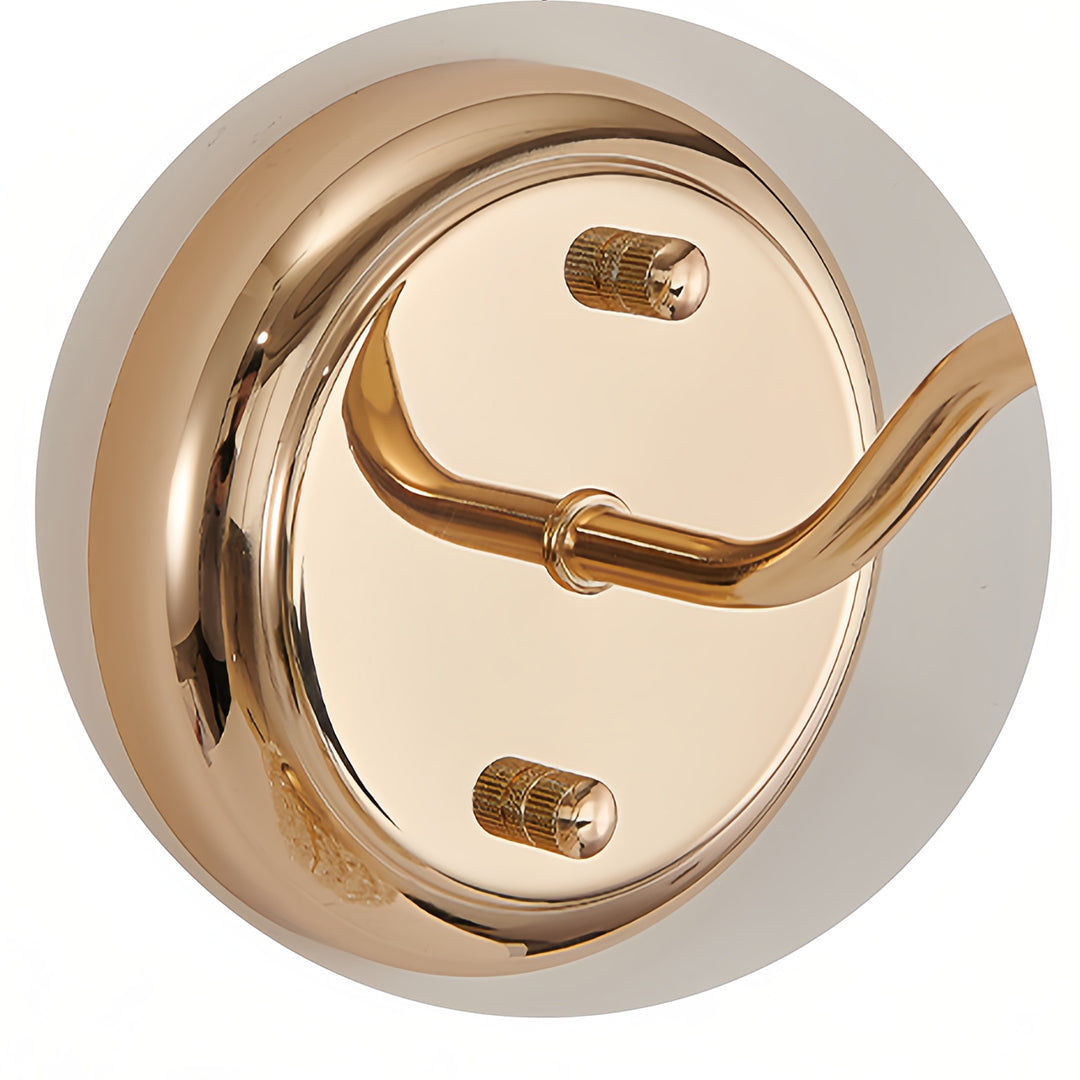 Detailed view of wall lights with crystals featuring glass shade chandelier design elements and polished gold backplate finish.