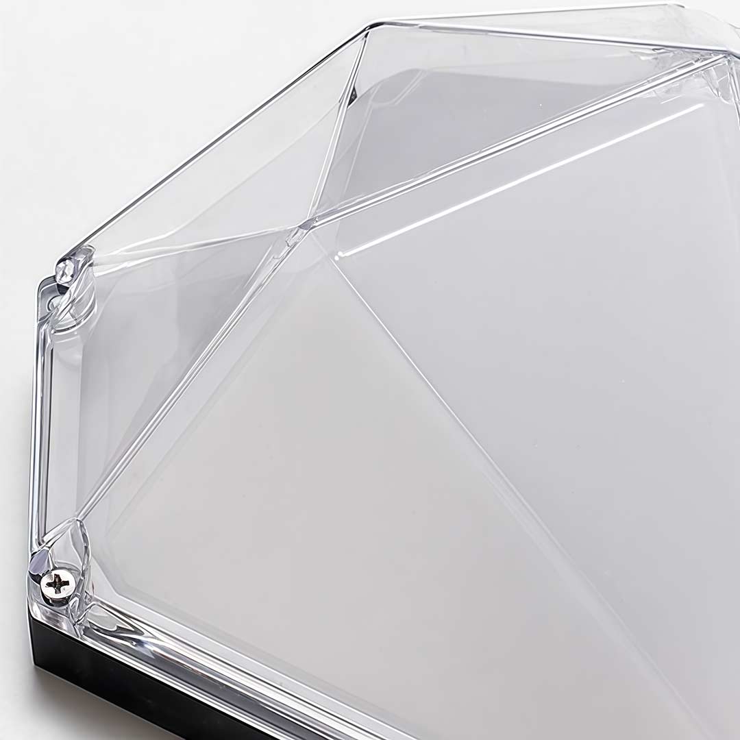 Diamond shape wall light with a modern design, providing warm illumination.