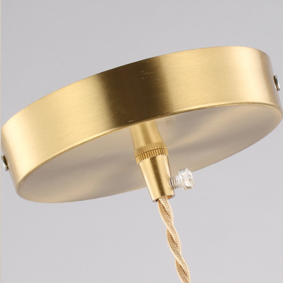 Diamond-shaped pendant light ceiling detail showing brass mounting hardware and premium construction quality craftsmanship