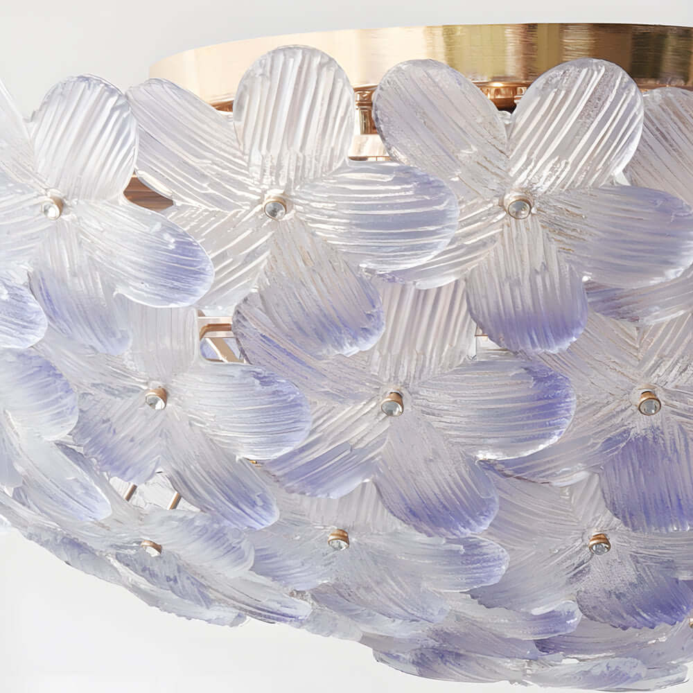 This French Petal Light adds a luxurious glow with its handcrafted glass design, making it an ideal ceiling fixture for creating warm, inviting, and aesthetically refined environments.