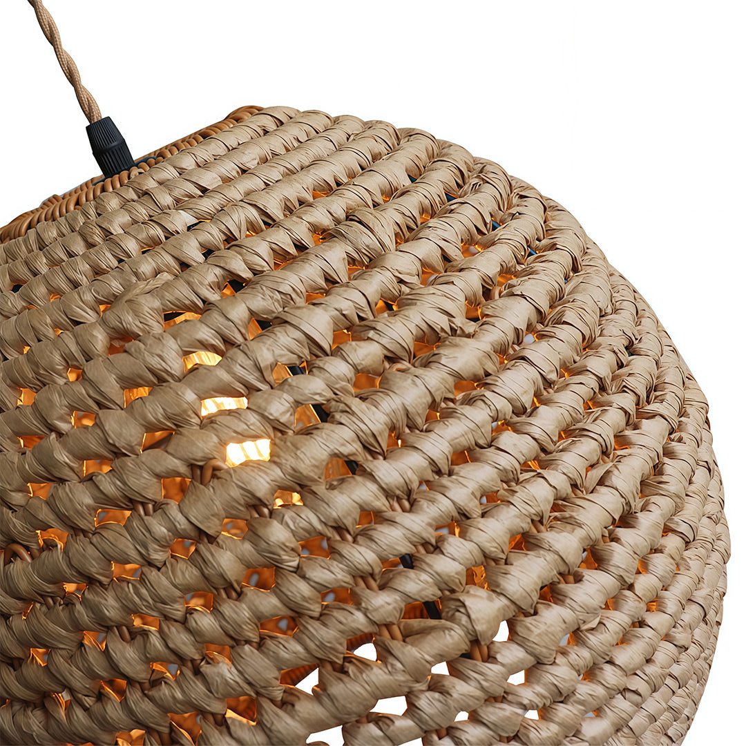 Japanese paper pendant light hanging above a dining area, combining traditional aesthetics with contemporary elegance.