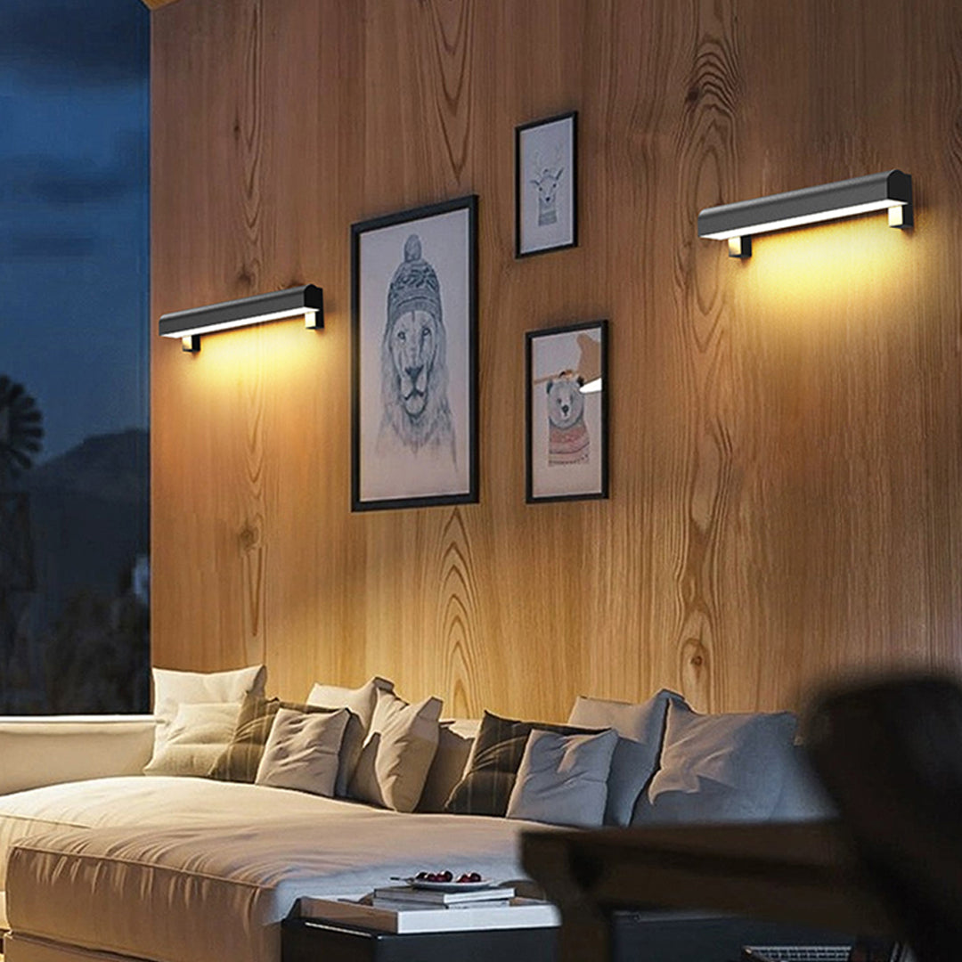 Ambient outdoor wall sconce light fixtures enhancing a cozy outdoor dining area with warm atmosphere.