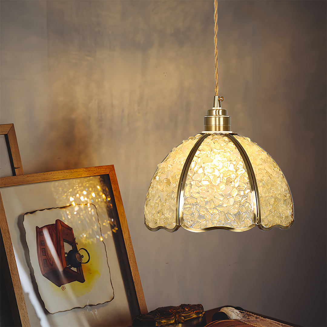 Textured crystal pendant light creating atmospheric lighting in modern dining area
