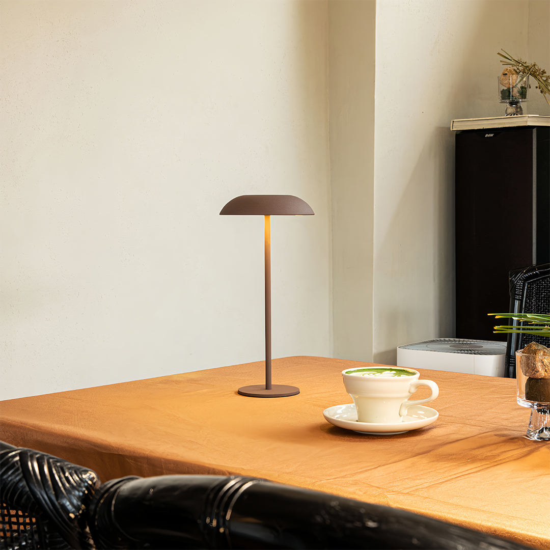 Elegant dining table setting enhanced by small black pendant light as centerpiece table lamp