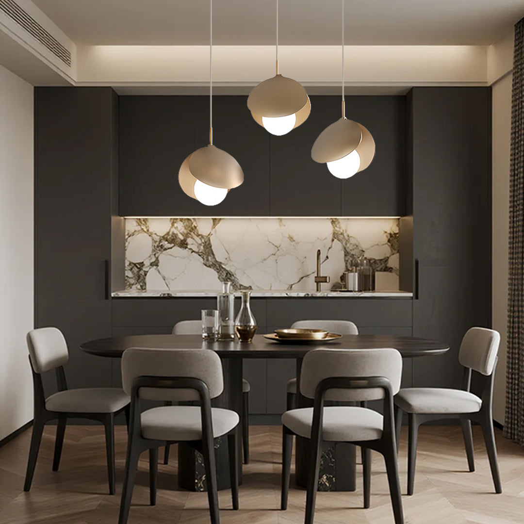 Contemporary dining room featuring 3 bulb pendant light installation over modern table setting
