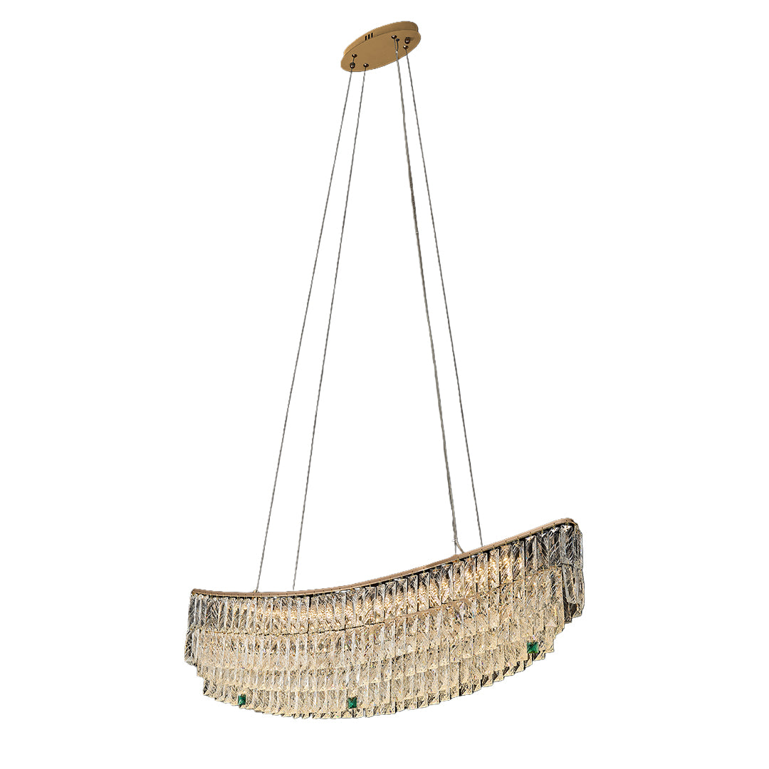 Dining room illuminated by curved crystal pendant chandelier above round table.