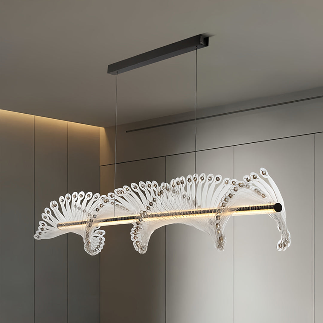 Sophisticated spiral chandelier suspended in modern dining room with flowing crystal arrangement and warm ambient lighting