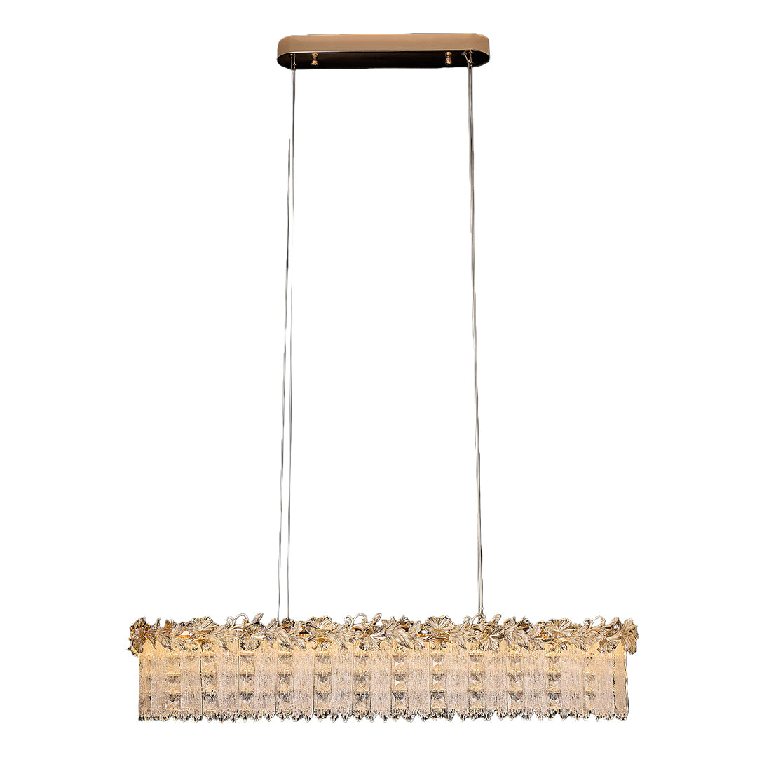 Gold chandelier crystal illuminating a modern dining room with warm glow.