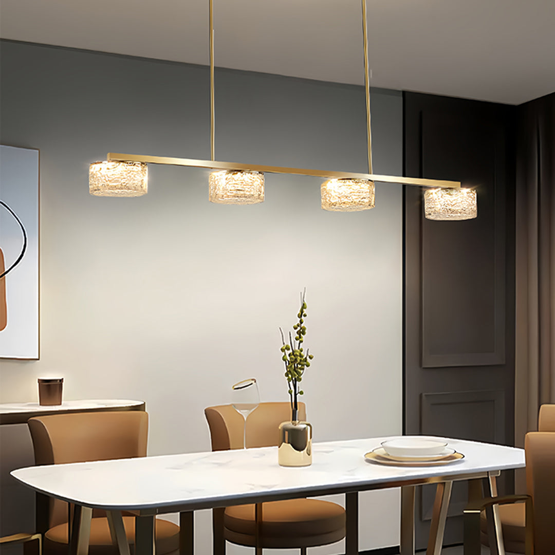 LED linear pendant light illuminating contemporary dining room with neutral decor and wooden table