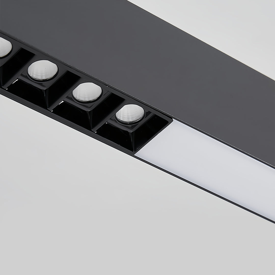 Dining room with white linear light pendant providing focused illumination over modern table