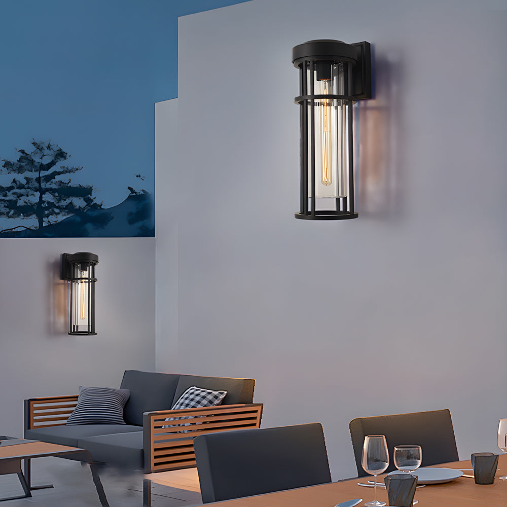 Modern dining terrace illuminated by coordinated wall-mounted lantern fixtures creating cozy atmosphere