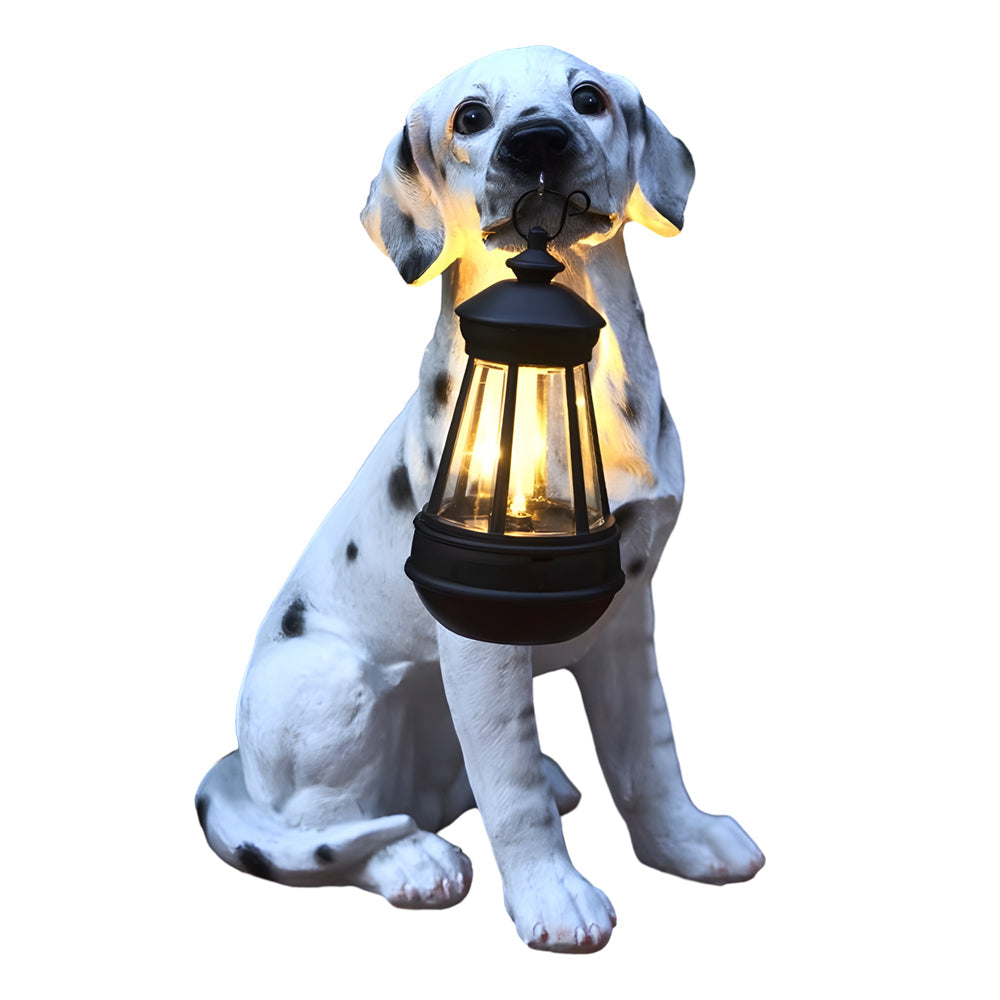 Isolated dalmatian dog solar light statue holding a lantern