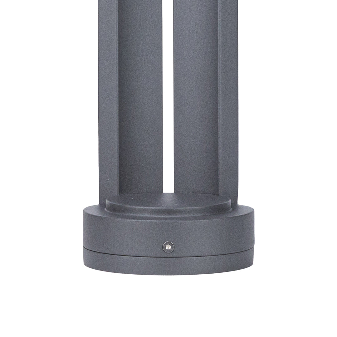 Modern gray bollard light with dome top and single vertical LED aperture