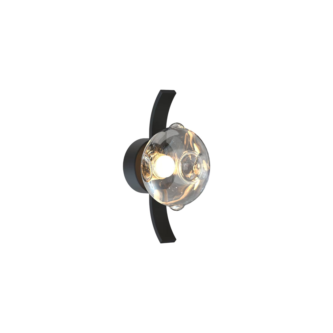 Dual glass globe wall sconce mounted on curved metal arm.
