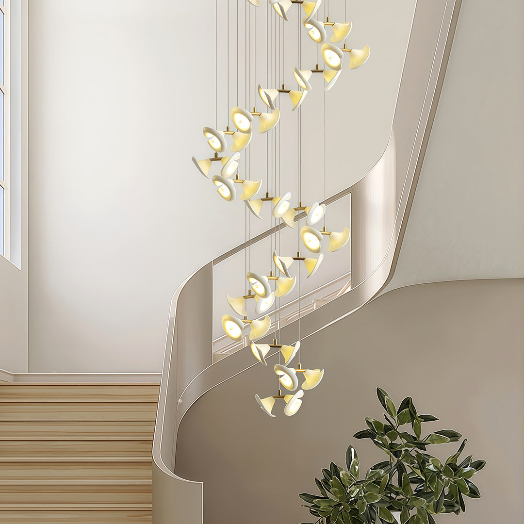 Tall modern brass chandelier with spiral design for double-height spaces.