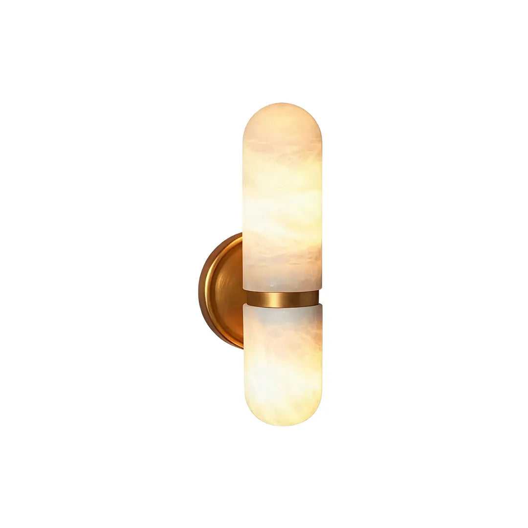 Double light wall sconce with frosted glass shades and brass finish isolated on a white background.