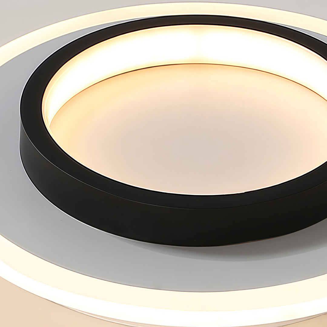 Double ring flush mount in black and white, side view of the geometric design.