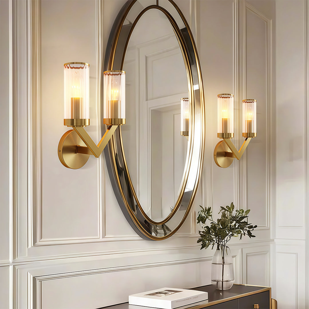 Modern luxury chandeliers style double sconce wall light beside oval mirror above marble console