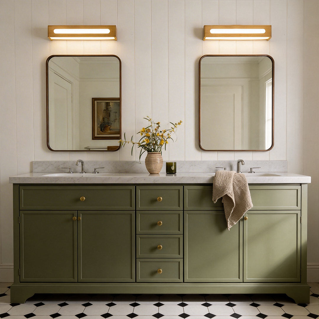 Double sink bathroom setup with wood vanity mirror light fixtures.