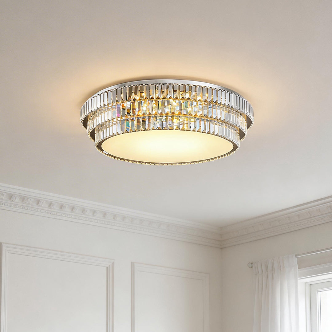 Modern led flush mount lighting with a double tiered crystal ring and a warm glowing diffuser.